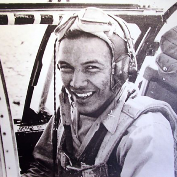 Portrait of Josh Sanford sitting in an airplane during WWII. Sanford served in the Army Air Corps during WWII and is credited with being the only Native American pilot to serve in China. Sanford eventually reached the rank of Captain, won the Fly Cross Award, and took part in at least 74 combat missions..